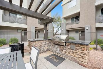 A BBQ zone is located in the courtyard of a residential building.